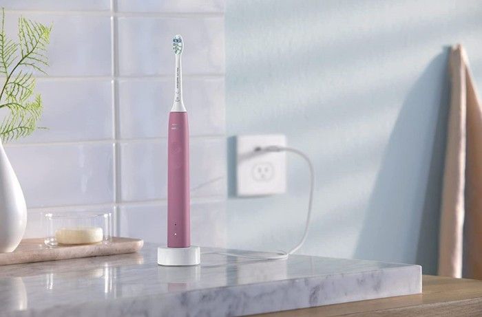 Photo of electric toothbrush in bathroom.