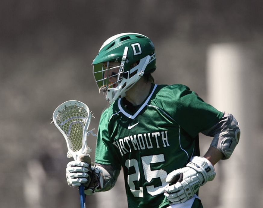 Photo of midfielder playing in a lacrosse game.