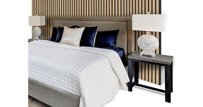 Photo of bedroom remodeled using fluted paneling.