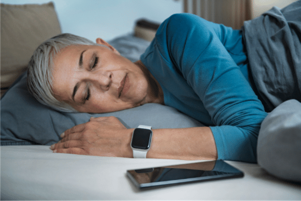 Photo of older woman sleeping comfortably in support of good health