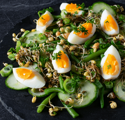 Photo of egg in a salad to support low-carb eating.