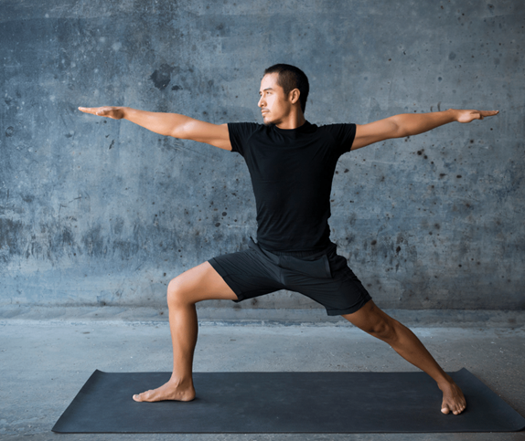 Photo of man practising Yoga pose.